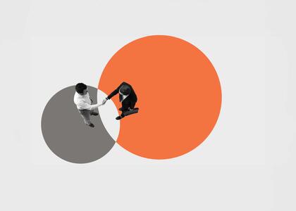 Asset Deal vs. Stock Deal in Business Sales shown by two men shaking hands and meeting in the middle