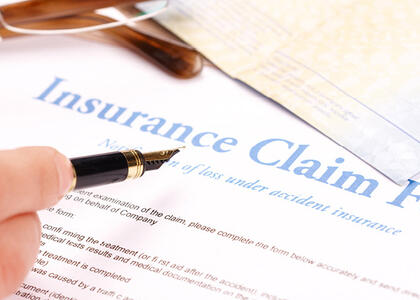 Pointing to an insurance claim form