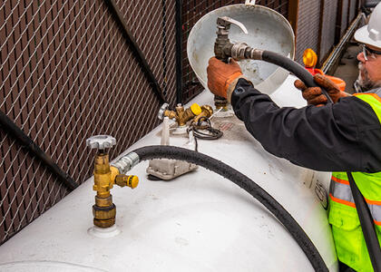 Workers practicing proactive propane maintenance