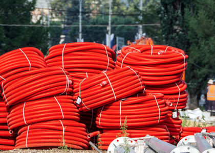 An image of PEX-AL-PEX piping is featured outdoors.