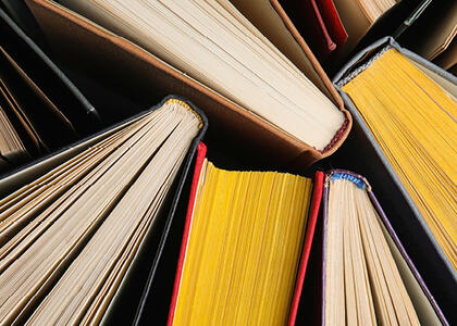 An image shows various books, emphasizing this month's Verbatim column question.