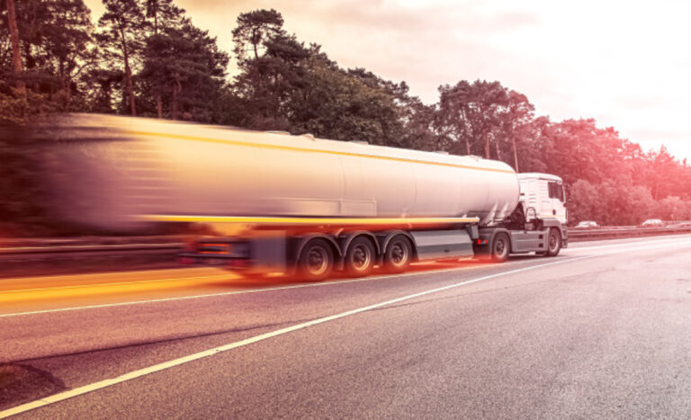 A bobtail is depicted in the midst of transporting propane. Propane supply decision-making planning goes into transportation.