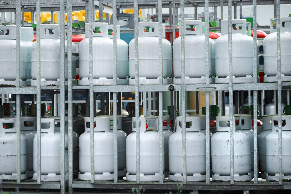 Gas cylinders for commercial propane use loaded on a transport truck