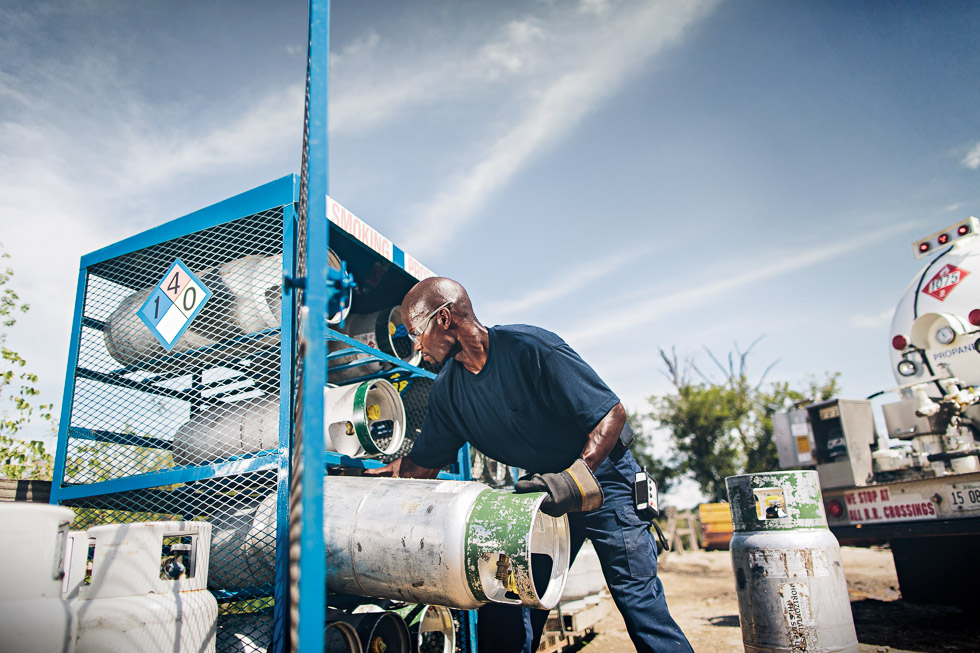 A photo of a propane provider restocking propane cylinders. Prefill inspection is important to do before that.