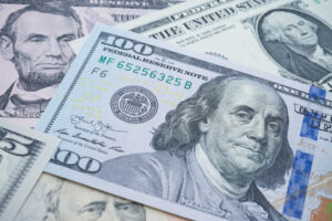 US president on many US dollars bill banknote background. All of this to represent the impact of propane autogas grants and other funding opportunities have on the industry