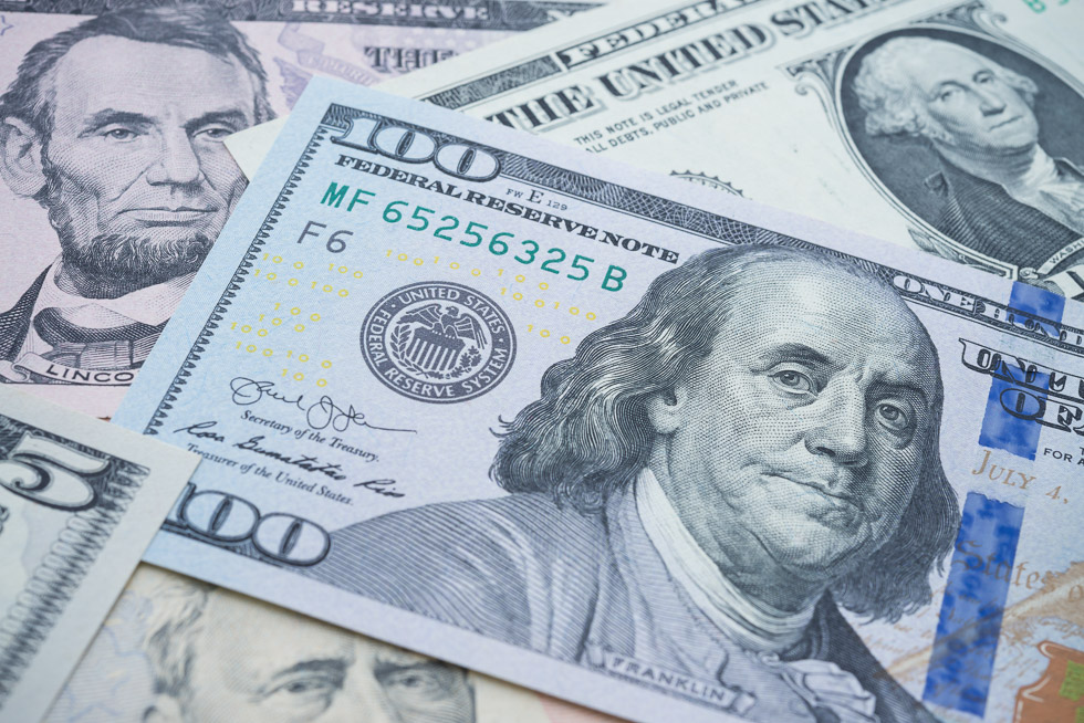 US president on many US dollars bill banknote background. All of this to represent the impact of propane autogas grants and other funding opportunities have on the industry