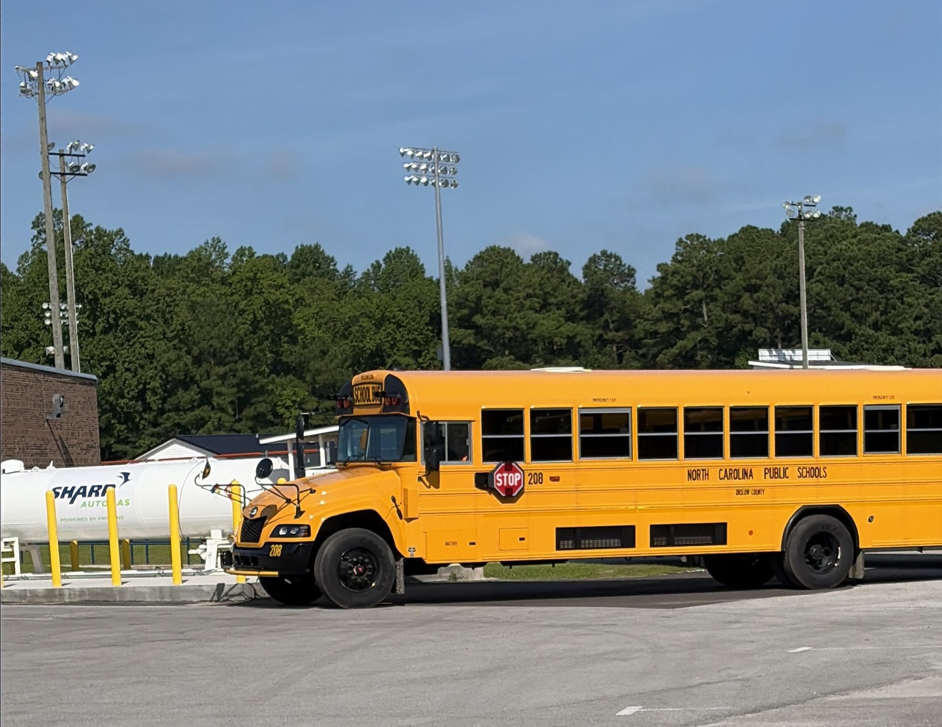 Propane autogas bus and Sharp fueling station are pictured