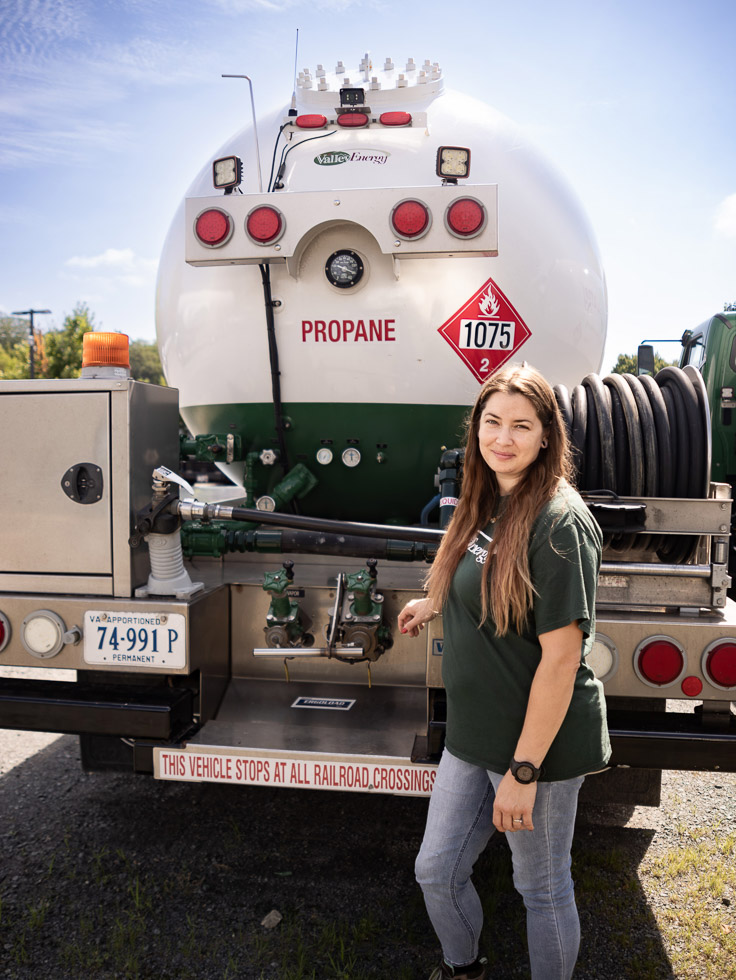 Propane CSR Cierra poses with Valley Energy truck